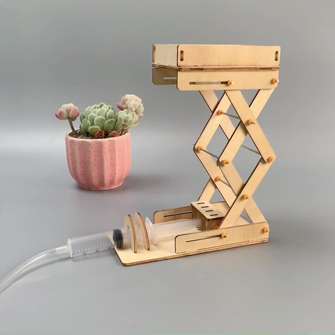 Completed wooden hydraulic lifting platform model for kids, showing its adjustable height and STEM learning potential.