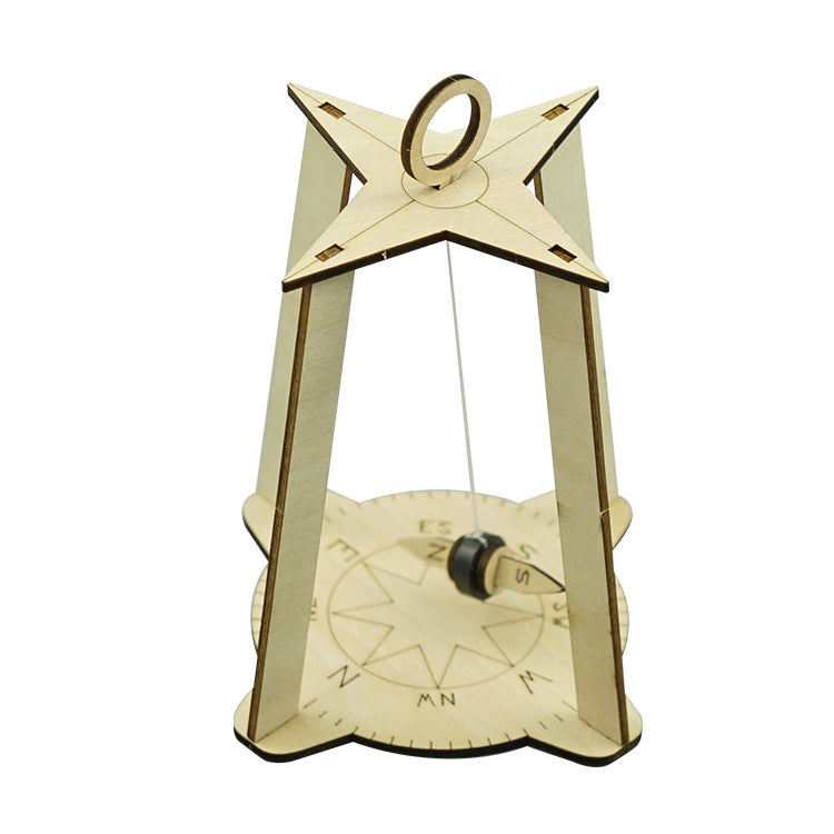 Detailed compass rose with North, South, East, West markings on DIY wooden kit.