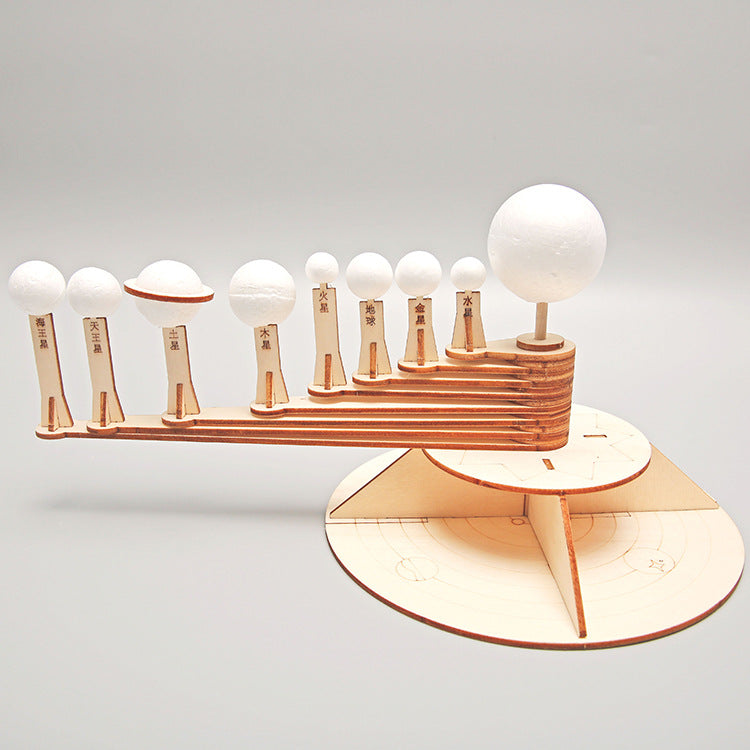 Another angle of the DIY Orrery Solar System kit, highlighting the intricate wooden gear mechanism