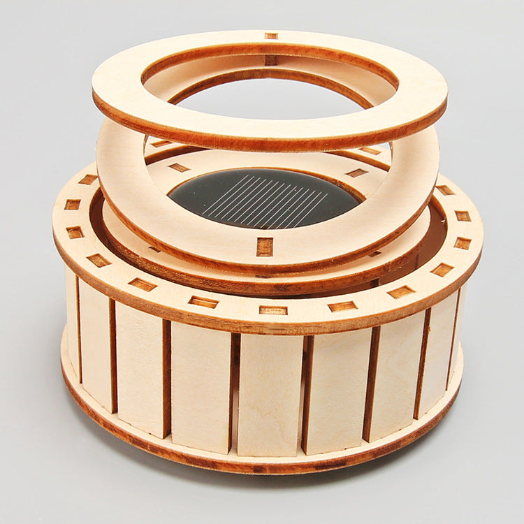 Assembled DIY Solar Double Ring Kit, a wooden educational toy powered by the sun.