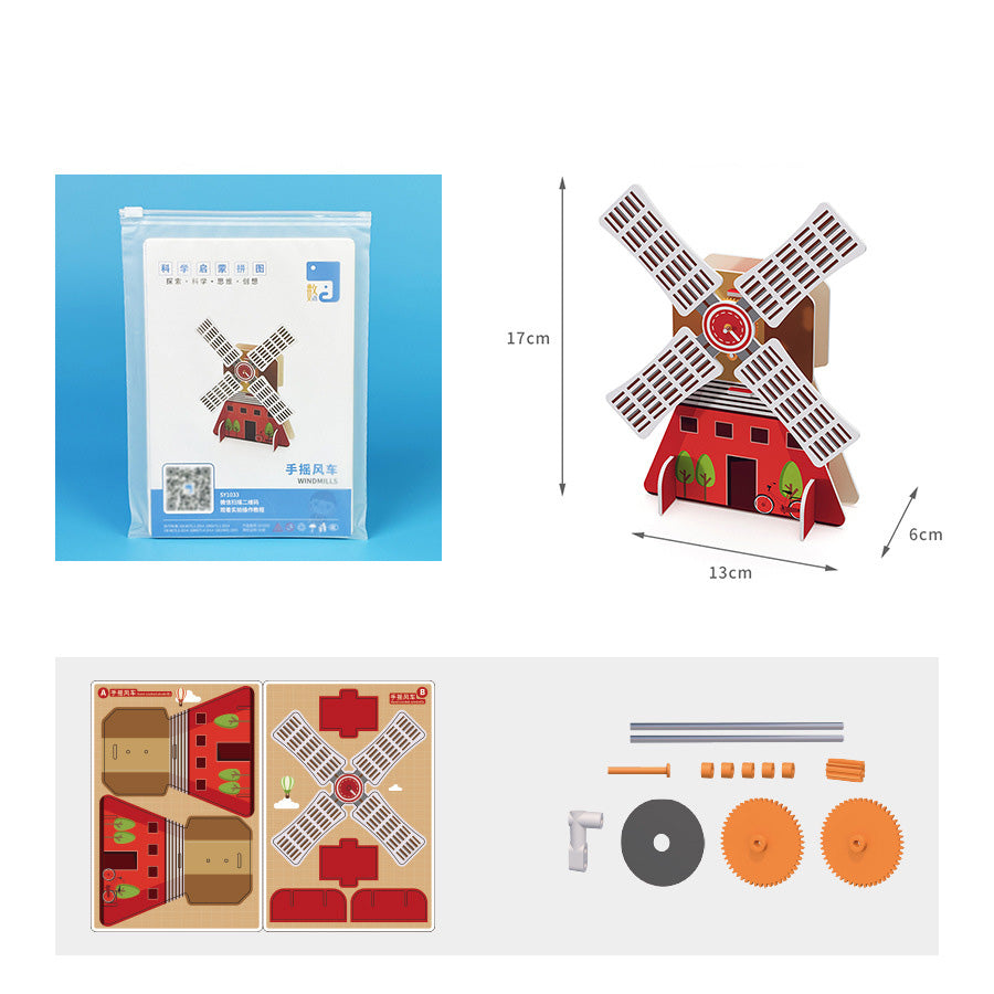Unboxed DIY Hand-cranked Windmill Kit showing pre-cut cardboard sheets and mechanical components.