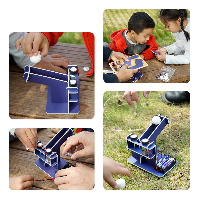 Hands-On Engineering Toy: Child building a cardboard automatic ball launcher.