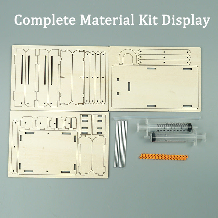 Complete DIY hydraulic lift kit contents: laser-cut wood pieces, syringes, tubes, and assembly hardware for kids.