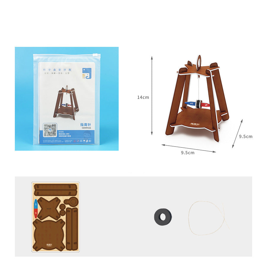 DIY compass kit contents: pre-cut cardboard pieces, magnet, string, and instructions