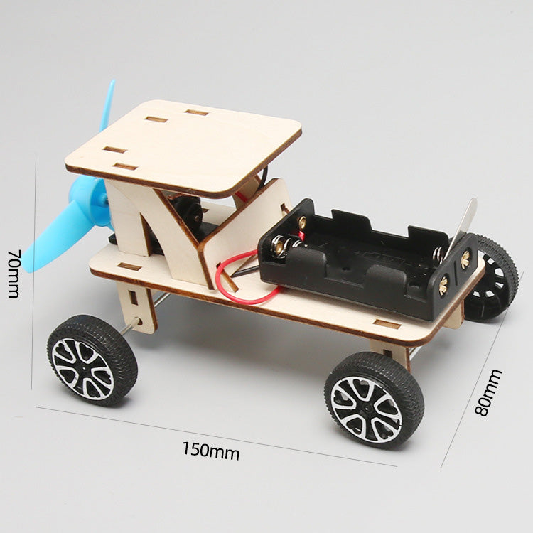 Detail of the propeller and motor on the DIY wind powered car, highlighting key mechanical components for educational play.
