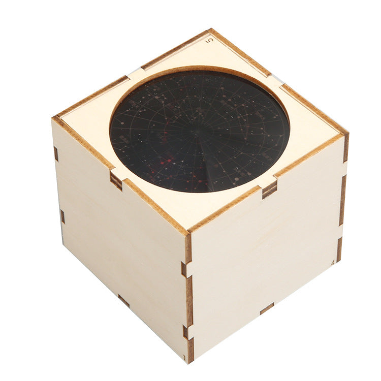 Complete parts for DIY Star Lantern: wooden pieces, bulb, battery pack, switch.