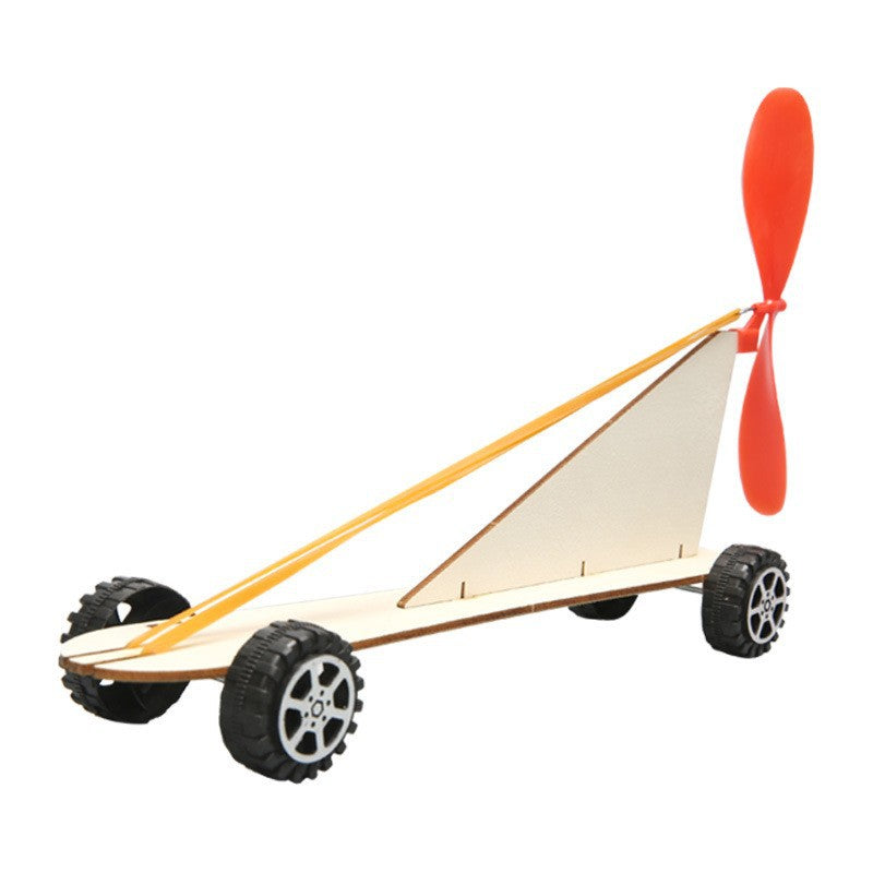 Angled view of the completed DIY Rubber Band Powered Car Kit, ready to roll.