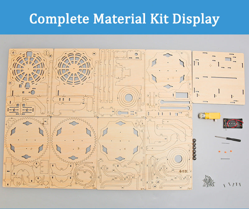 Complete DIY Ball Track Kit contents: Laser-cut wood pieces, motor, and assembly parts laid out.