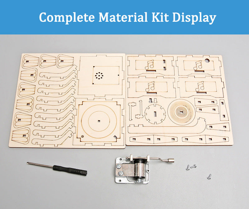 Complete materials for the DIY Gramophone Kit, including laser-cut wooden pieces and music box mechanism.