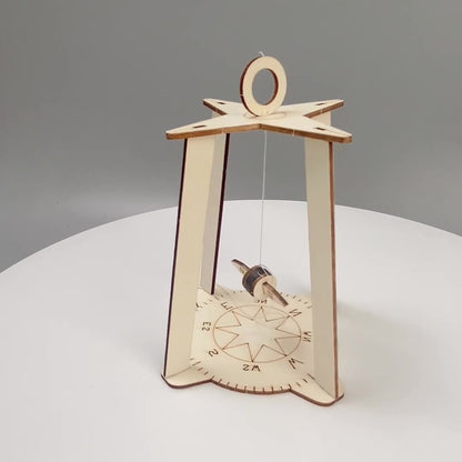 Assembled wooden DIY Compass Kit, a fun STEM learning toy for children.