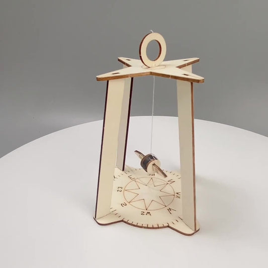 Assembled wooden DIY Compass Kit, a fun STEM learning toy for children.