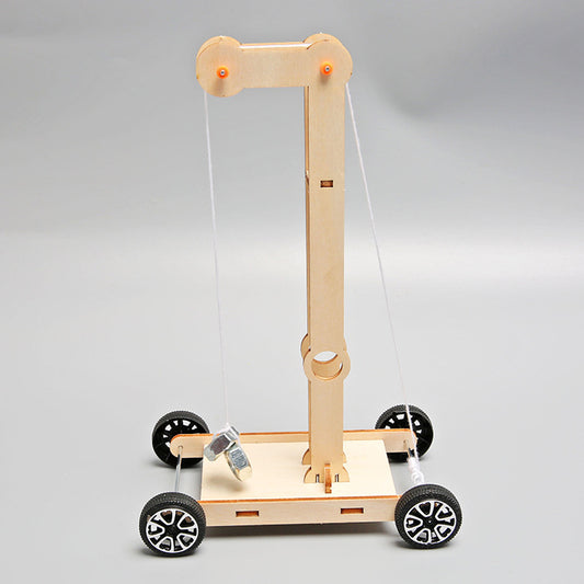 Completed DIY wooden gravity-powered vehicle toy for science exploration.