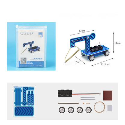Unboxing the Electromagnetic Launcher Kit: Cardboard pieces, electronic components, and building materials.