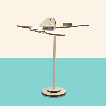 Finished DIY wooden balancing bird with magnetic weights, ready to balance.