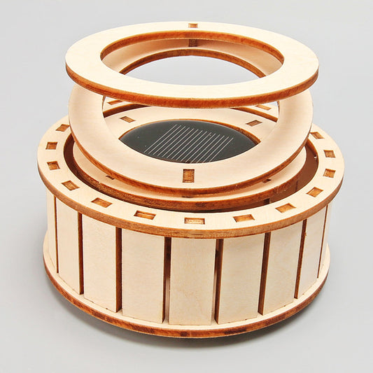 Assembled DIY Solar Double Ring Kit, a wooden educational toy powered by the sun.