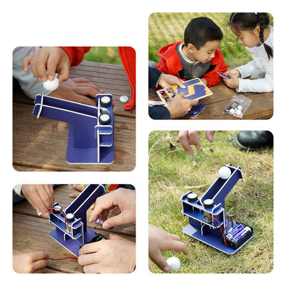 Hands-On Engineering Toy: Child building a cardboard automatic ball launcher.
