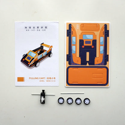 DIY Pull-back Car Kit Contents: Pre-cut cardboard, wheels, pull-back motor, and instructions.