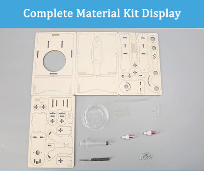 Material kit contents for the DIY Hand-operated Water Pump Kit, including wooden boards, syringes, tubes, and screws.