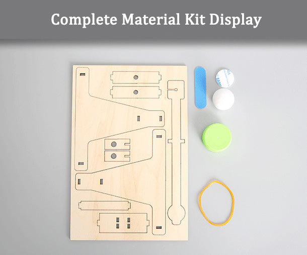 Complete material kit for the DIY Catapult: laser-cut wood, rubber band, ball.