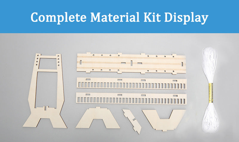 Contents of DIY Cable-stayed Wall Kit: laser-cut wooden pieces, white tension cables, and assembly tools.