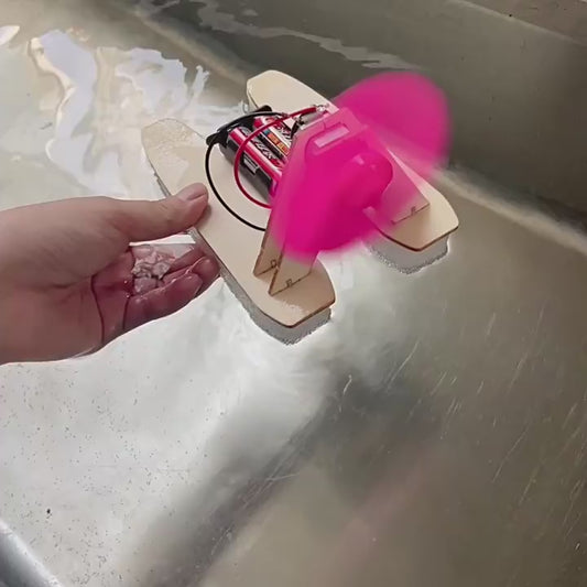 DIY Hovercraft Kit in action, propelled by a spinning pink propeller.