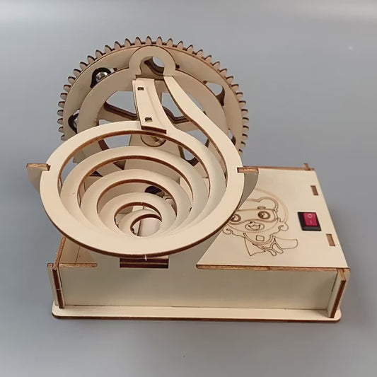 DIY Steel Ball Slide Kit in action, showcasing the marble run and motorized lift.