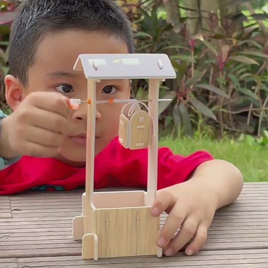 DIY wooden well sweep model kit in packaging and assembled, demonstrating its features.