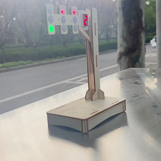 DIY Wooden Traffic Light Kit in action, showing the red, yellow, and green lights illuminating with the digital countdown timer.