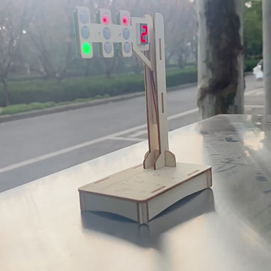 DIY Wooden Traffic Light Kit in action, showing the red, yellow, and green lights illuminating with the digital countdown timer.