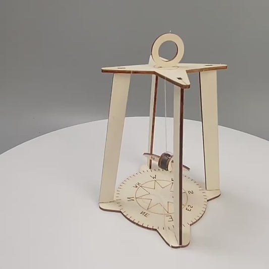 DIY Compass Kit assembly steps for kids shown in educational video.