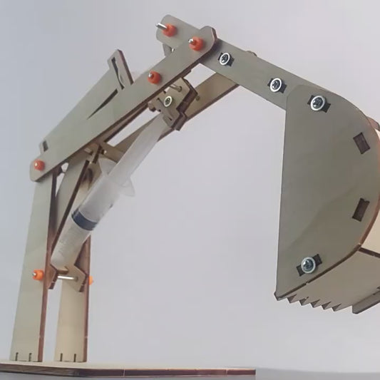 Hands-on DIY Hydraulic Excavator Kit in action, showcasing its movement and hydraulic functionality.