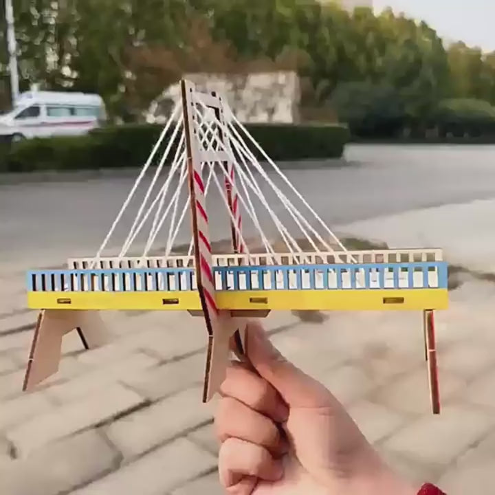 Kids building DIY cable-stayed wall kit, showing step-by-step assembly and finished structure.