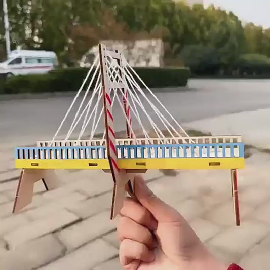 Kids building DIY cable-stayed wall kit, showing step-by-step assembly and finished structure.