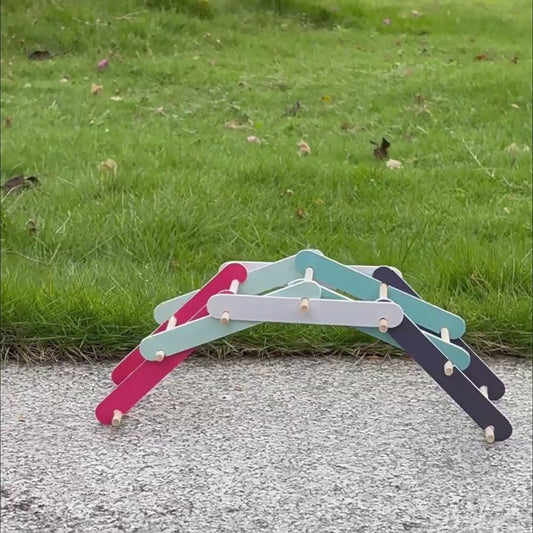 Video demonstration of a child building a colorful DIY Bailey Bridge model.