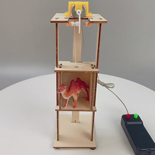 Kids building a DIY electric elevator model, demonstrating STEM learning and hands-on fun.