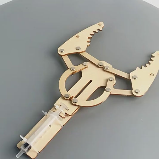 Animated DIY hydraulic robotic arm toy in action, demonstrating STEM learning for kids.
