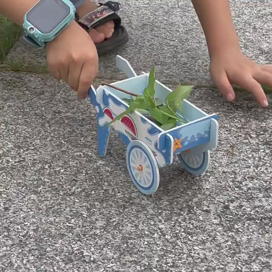 DIY Handcart Kit: Unboxing and assembly of a colorful cardboard toy wheelbarrow for kids, showcasing included materials and easy steps.