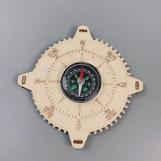 A child's hands assembling a DIY wooden compass kit, showing the educational STEM experience. The compass features laser-cut wooden parts and a real magnetic compass.