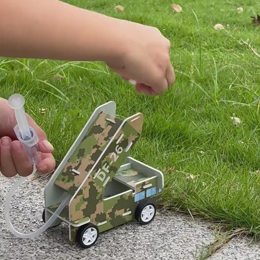 DIY Air Cannon Toy in action, launching a white ball.