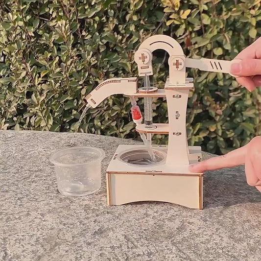Fully assembled DIY Hand-operated Water Pump Kit showcasing its mechanical structure and functionality.